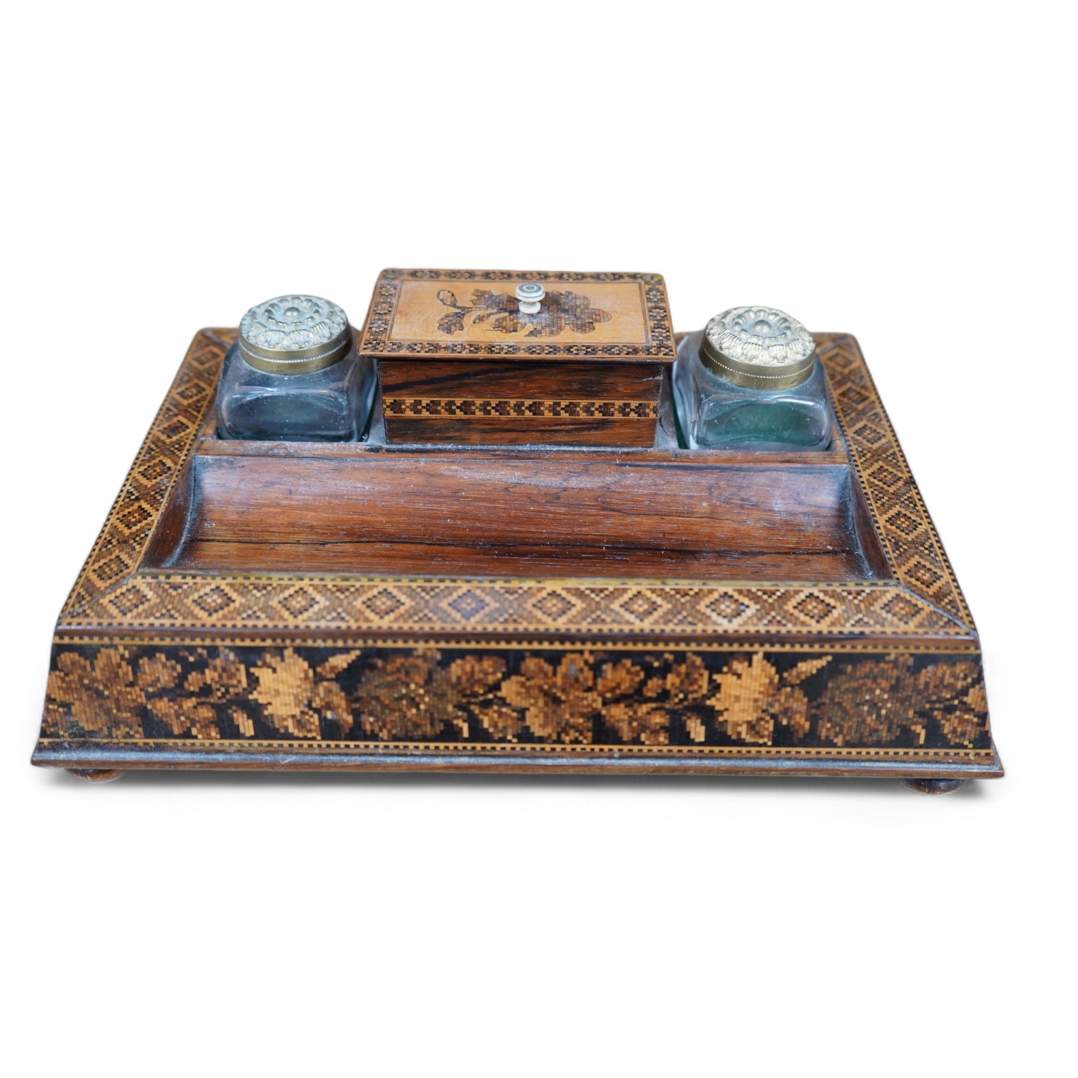 A Tunbridge ware rosewood inkstand with two glass ink bottles, 26cm wide. Condition - fair